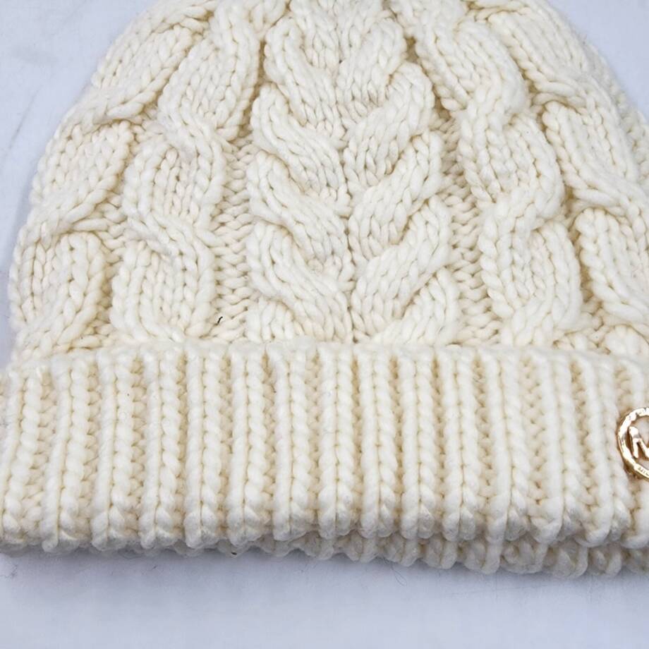 Michael Michael Kors Moving Cables Knit Hat Women's Cream Ribbed Logo Charm
