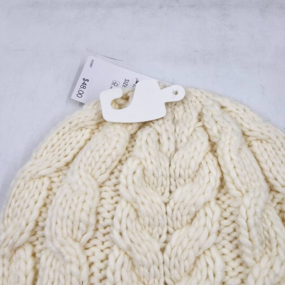 Michael Michael Kors Moving Cables Knit Hat Women's Cream Ribbed Logo Charm